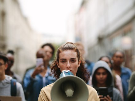 Protesters speaking into megaphone