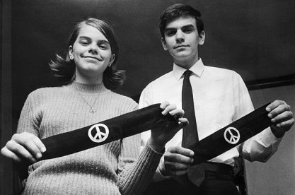 Mary Beth Tinker and John Tinker holding peace bandanas