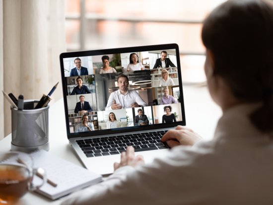 Laptop with people in video call